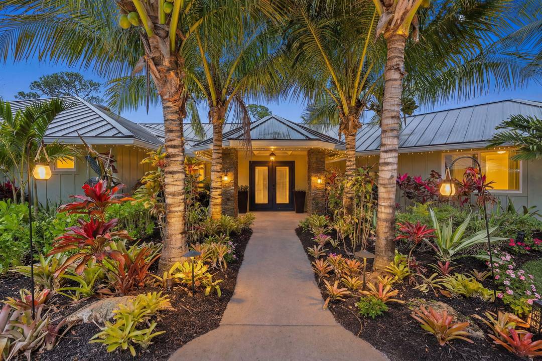 Nestled in the heart of Palm City's premier golf and boating community, this exceptional residence offers the coveted Piper's Landing lifestyle paired with a private backyard retreat.
