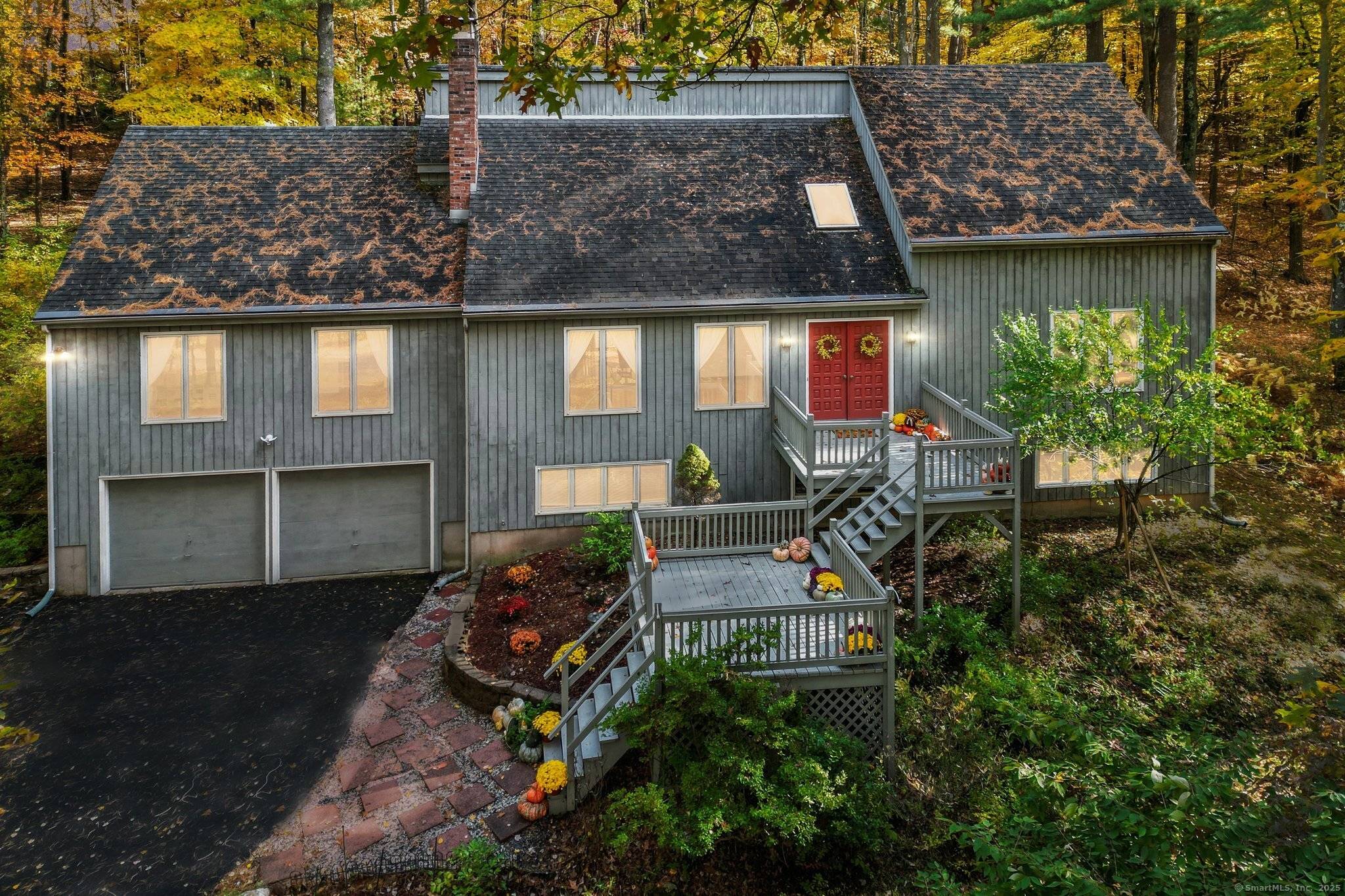 Nature Lovers Retreat ! Just one mile from town yet set back on a quiet cul de sac, this remarkable property offers complete privacy on 2.