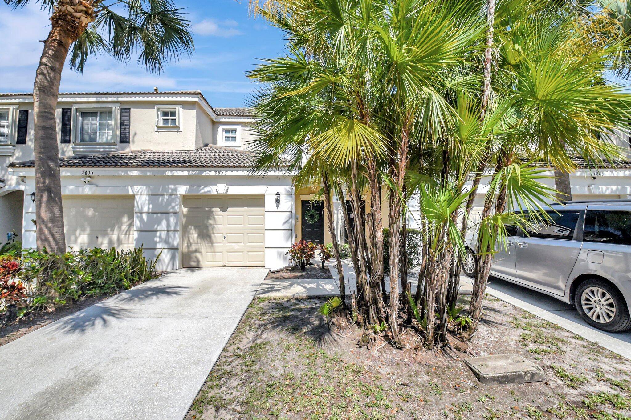 Welcome to 4838 Palmbrooke Circle, a beautifully remodeled townhome in the sought after Jonathan's Cove community of West Palm Beach.