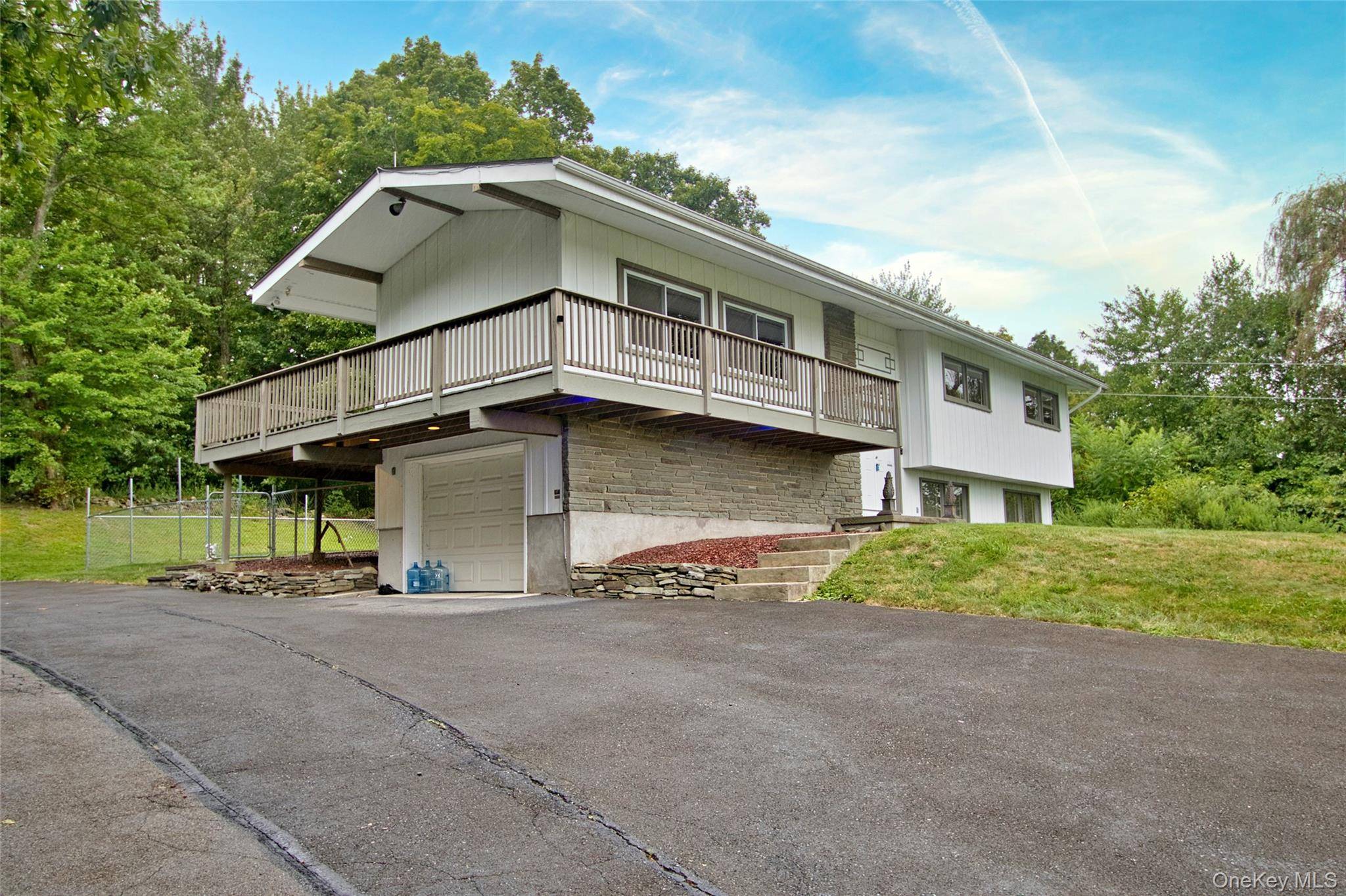 Tucked away on a quiet dead end road, set high with scenic mountain views, this well kept Raised Ranch is ready for your next chapter in the Hudson Valley.