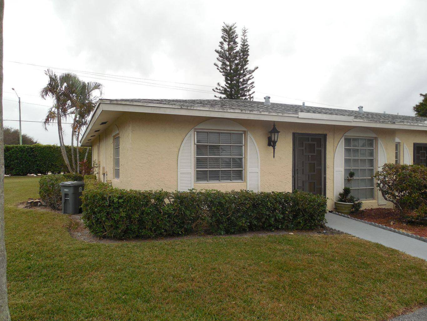 Beautiful 2 bed 2 bath villa in Palm Greens Delray, a 55 active Adults community, a corner condo with spacious living area and porch enclosure.