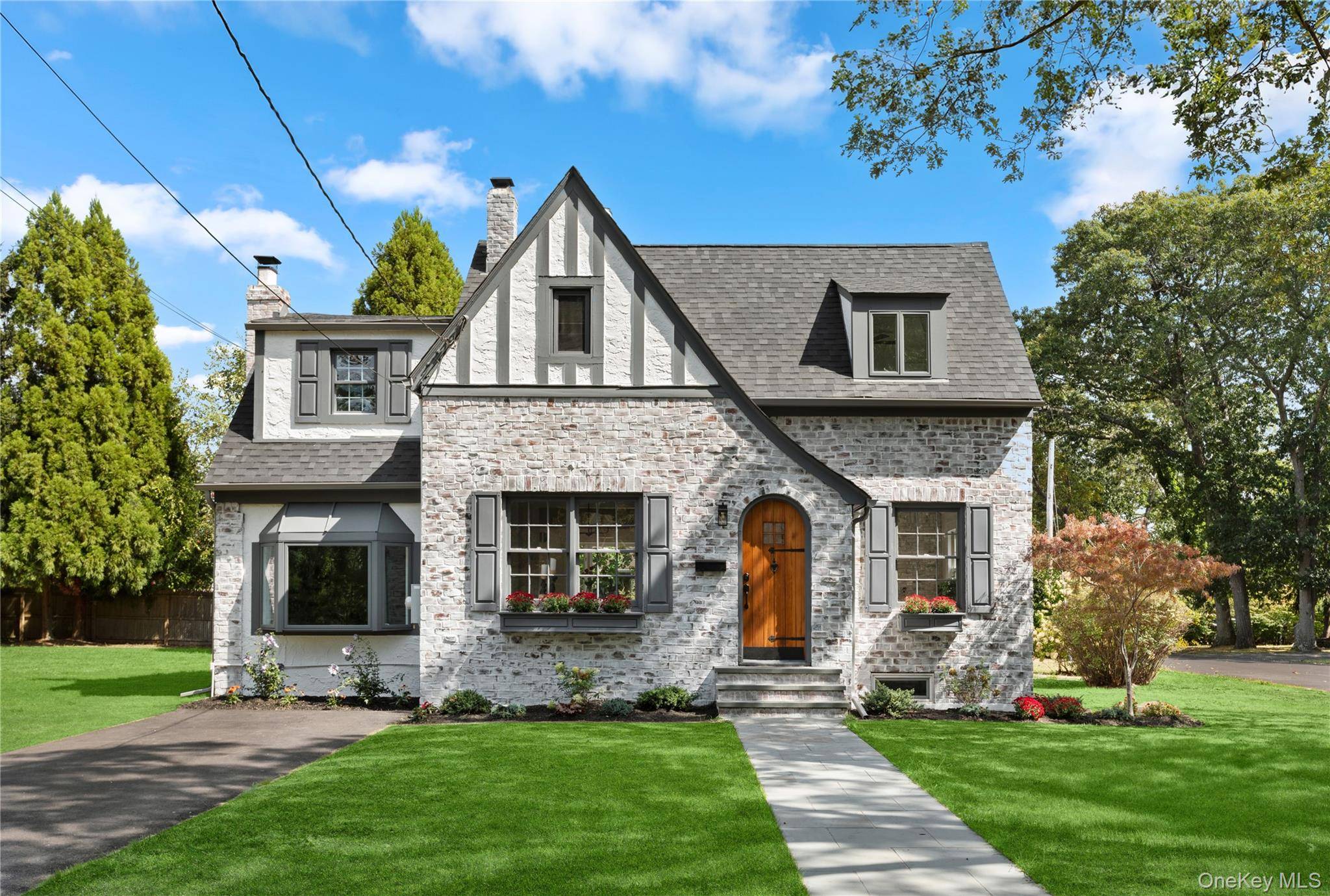 If a home could step out from the pages of a fairytale, this stunning Tudor style gem would be the one.