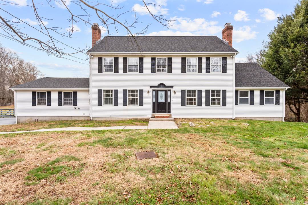 Welcome to this beautifully maintained Colonial set on over 8 private acres in Colchester.