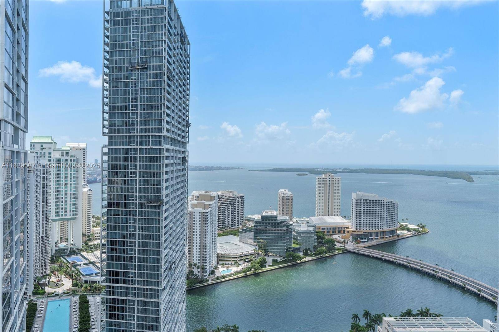 Enjoy sweeping views of the Miami River, ocean, and Brickell skyline from this bright and spacious sub penthouse.