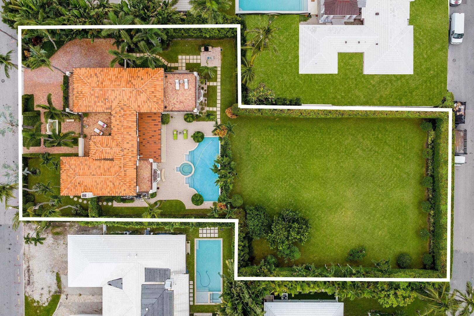 Stunning home on fantastic, rare double 26, 500 square foot lot in Palm Beach's North End.