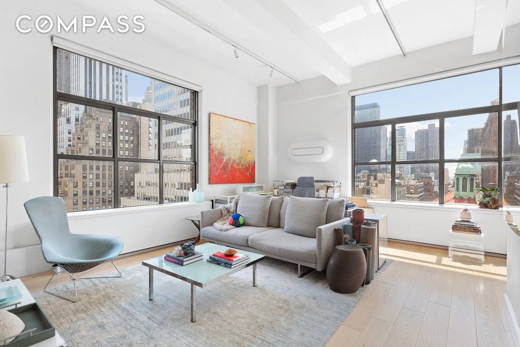 We are in a New York state of mind in this breathtaking corner loft at 244 Madison in the heart of New York City.