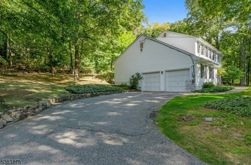 Enjoy this private setting, single family home in Parsippany bordering Morris Plains.