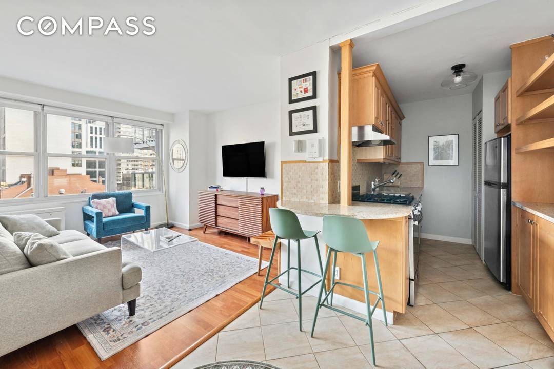 Beautifully renovated high floor studio, thoughtfully converted into a one bedroom, offering open city views in a prime Upper East Side location.