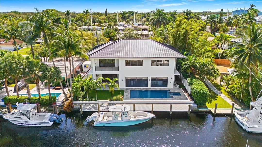 Welcome to 1317 Tangelo Isle, a stunning New Construction single family home on the water.