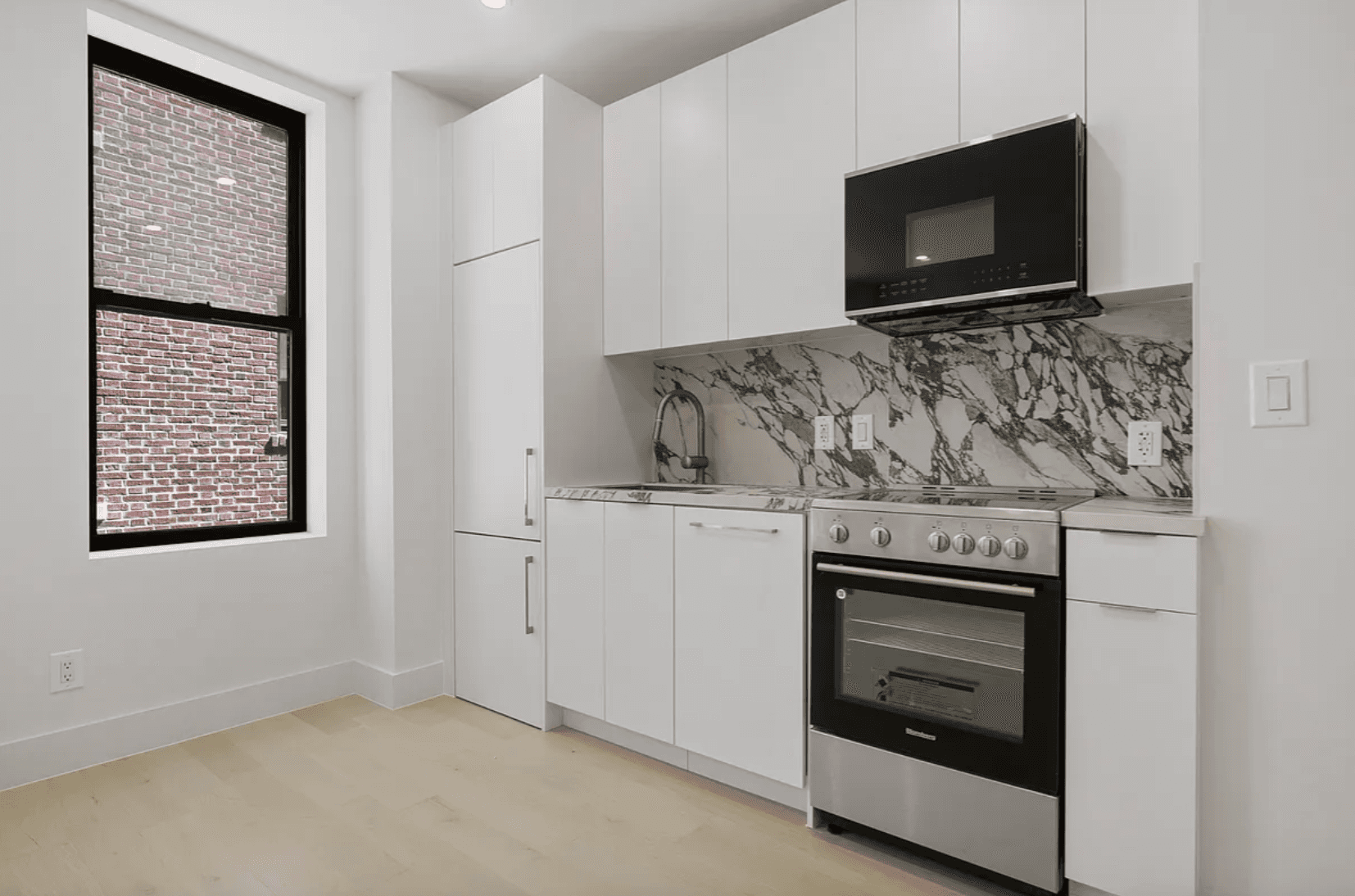 Beautifully gut renovated 2 bedroom, 1 bath residence featuring a stunning large kitchen with stainless steel appliances, wide plank Oak flooring, spacious bedrooms and in unit washer dryer.