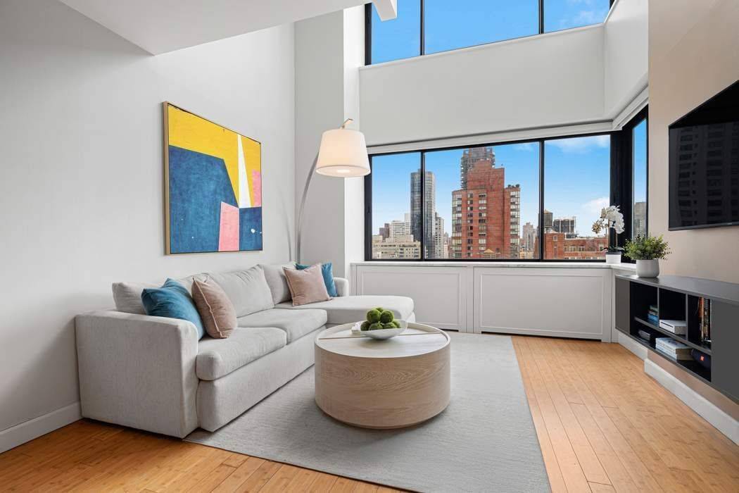 Corner Duplex with Sweeping City amp ; River Views Exceptional Value on the Upper East Side Residence 2103 at The Paladin Condominium is a sun flooded 1 bedroom, 1.