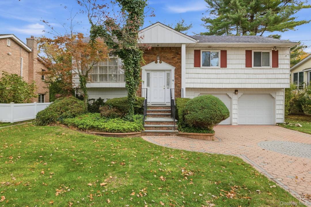 This beautiful Hi ranch in excellent condition is located in the heart of Manhasset Hills sitting on an oversized 8, 750 sq ft lot.