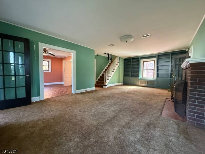 Perfect opportunity to move in while renovating, this charming 4 bedroom 2 full bath Tudor located on a picturesque tree lined street in Plainfield.