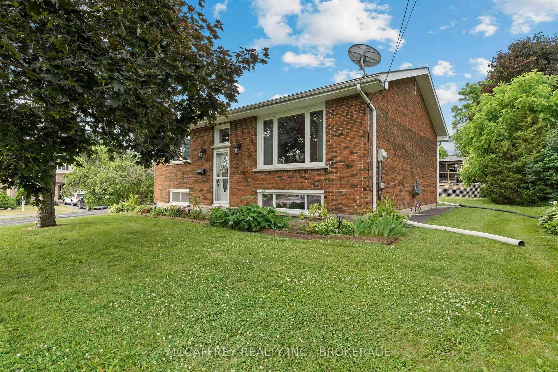 This charming all brick elevated bungalow is a perfect blend of comfort and convenience, ideal for those seeking a tranquil lifestyle with easy access to amenities.