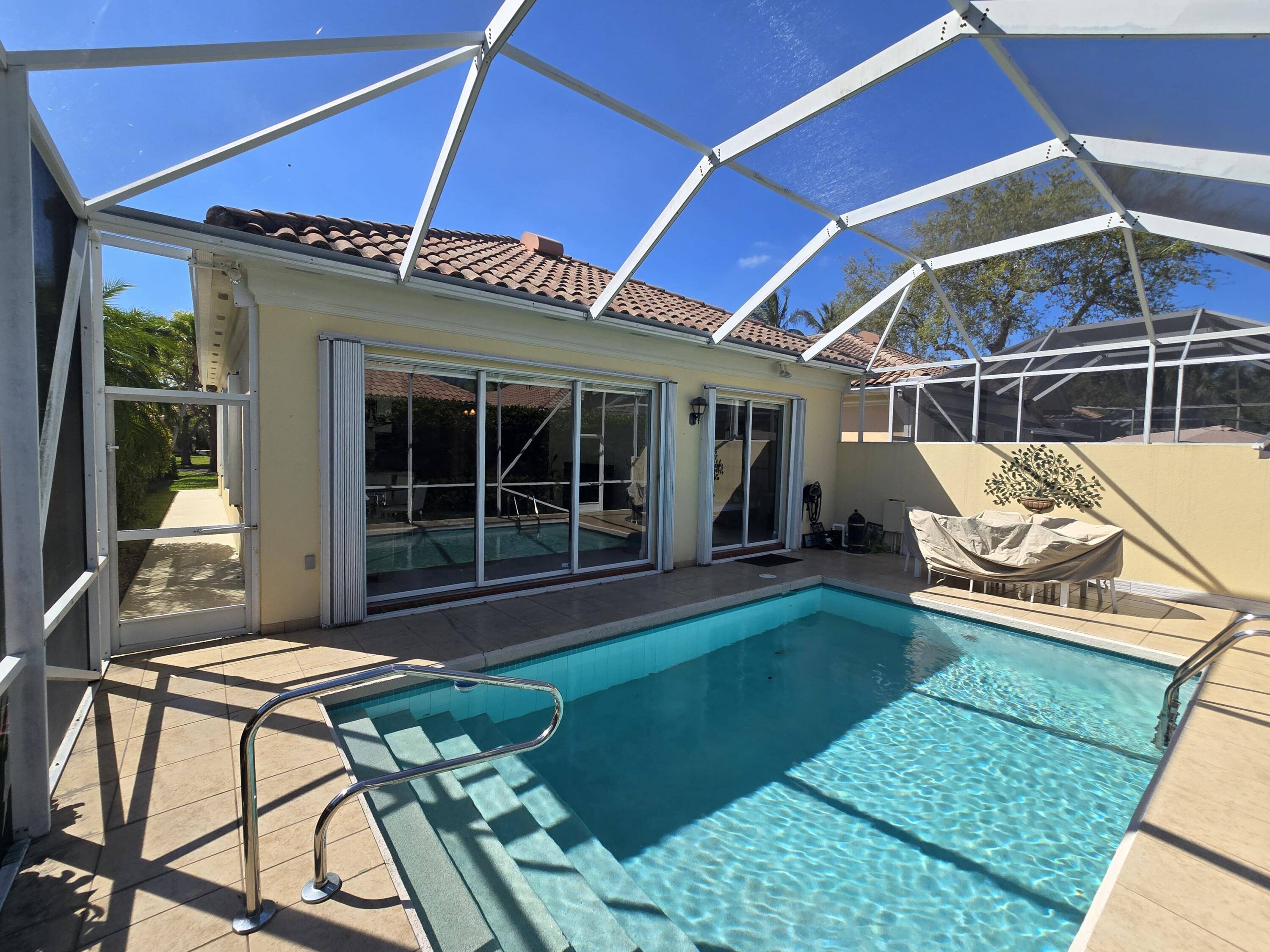 Beautifully Remodeled Home with New Kitchen New Bathrooms New Porcelain Tile Flooring Throughout Freshly Painted This Property has Hurricane Protection and a NEW ROOF Coming in APRIL 2025.