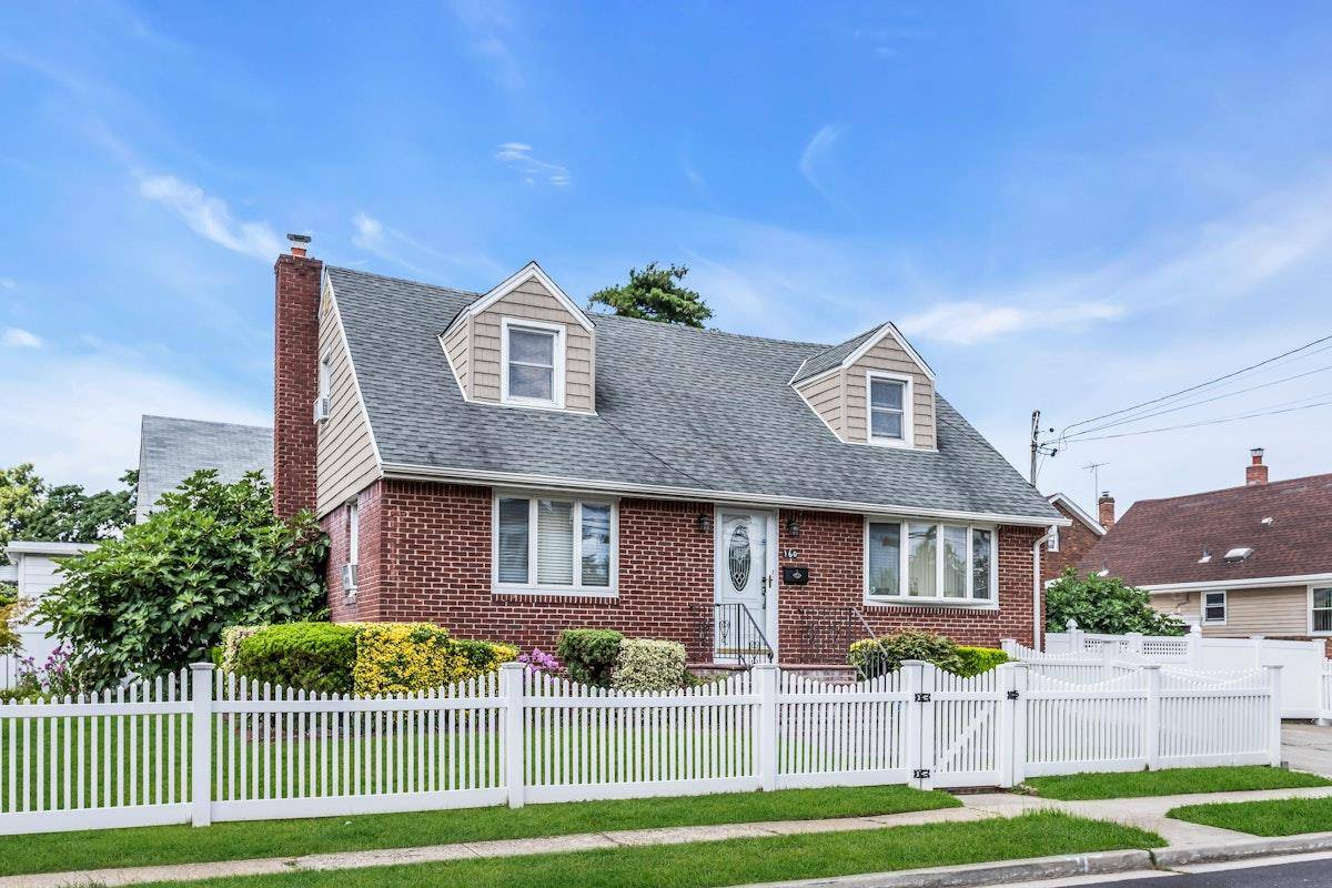 Wide Line Mint Center Hall Brick and Siding Cape Cod in the Village of Valley Stream.