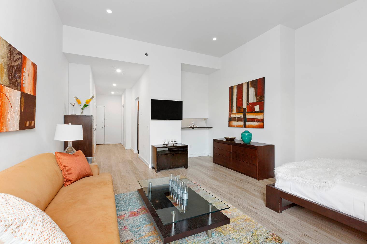Unit 22M is a spacious alcove studio loft with 12 ft ceilings.