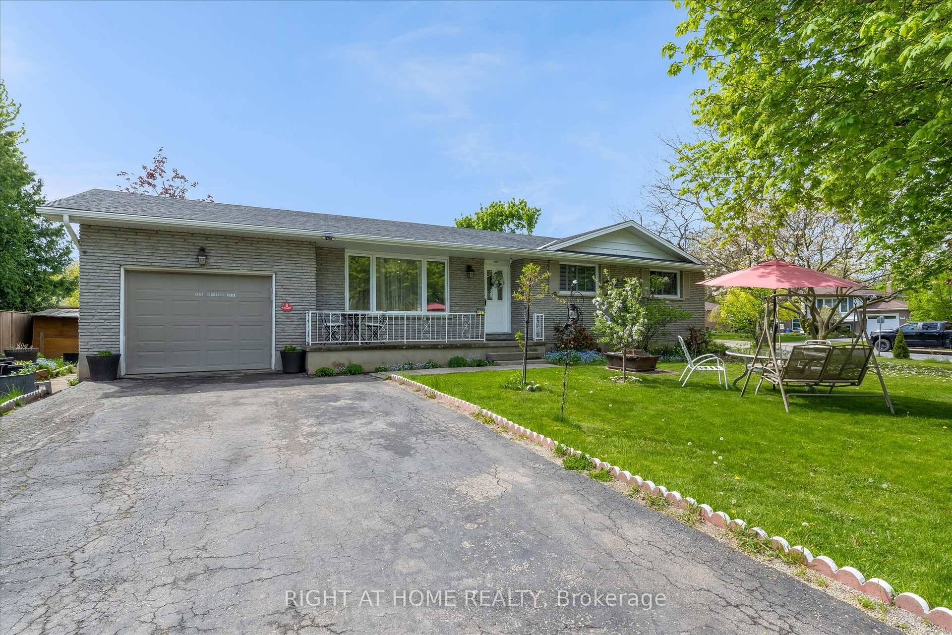 Nestled on a generous 82 x 99 ft corner lot in the heart of Beamsville, this charming bungalow offers over 1, 800 sq ft of versatile living space.