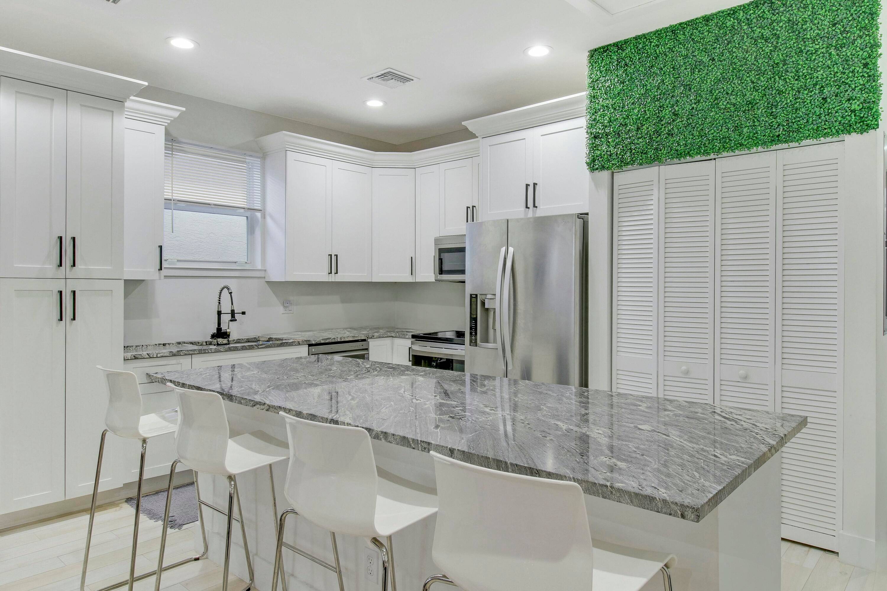 Stunning CBS pool home built in 2022 featuring 3 spacious bedrooms, 2 full baths, complete impact glass, tile throughout, tankless water heater, stainless steel appliances, open floor plan, and a ...