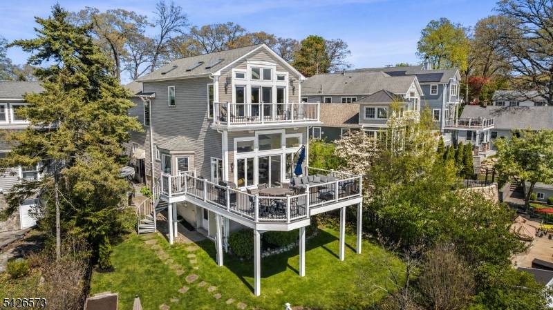 This exceptional lakefront home offers 4 spacious bedrooms, 3 full bathrooms, and 1 half bath, thoughtfully designed for both everyday living and effortless entertaining.
