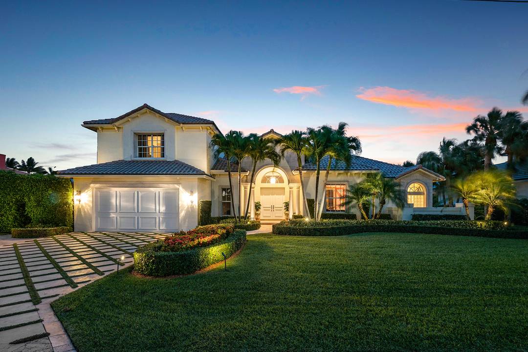 Nestled on one of the many island communities in Ocean Ridge, this stunning home defines the Florida Lifestyle.
