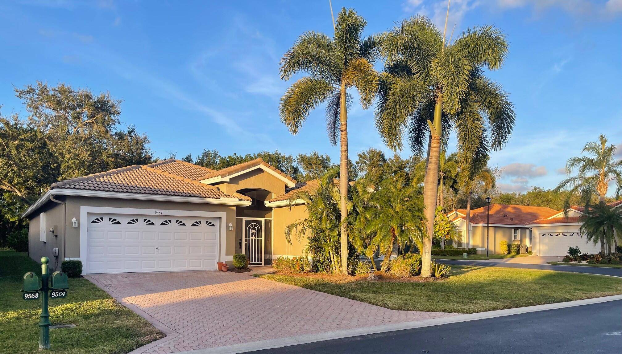 This large, single family home in the 55 community The Grove, sits on a corner lot and is very private.