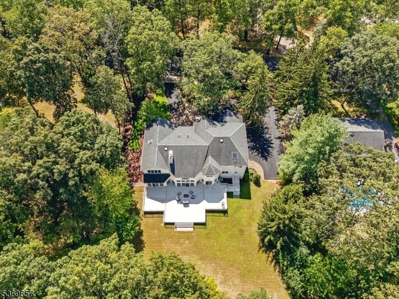 Custom built by the owner, this elegant 5 bedroom residence is bathed in natural light with oversized windows throughout.