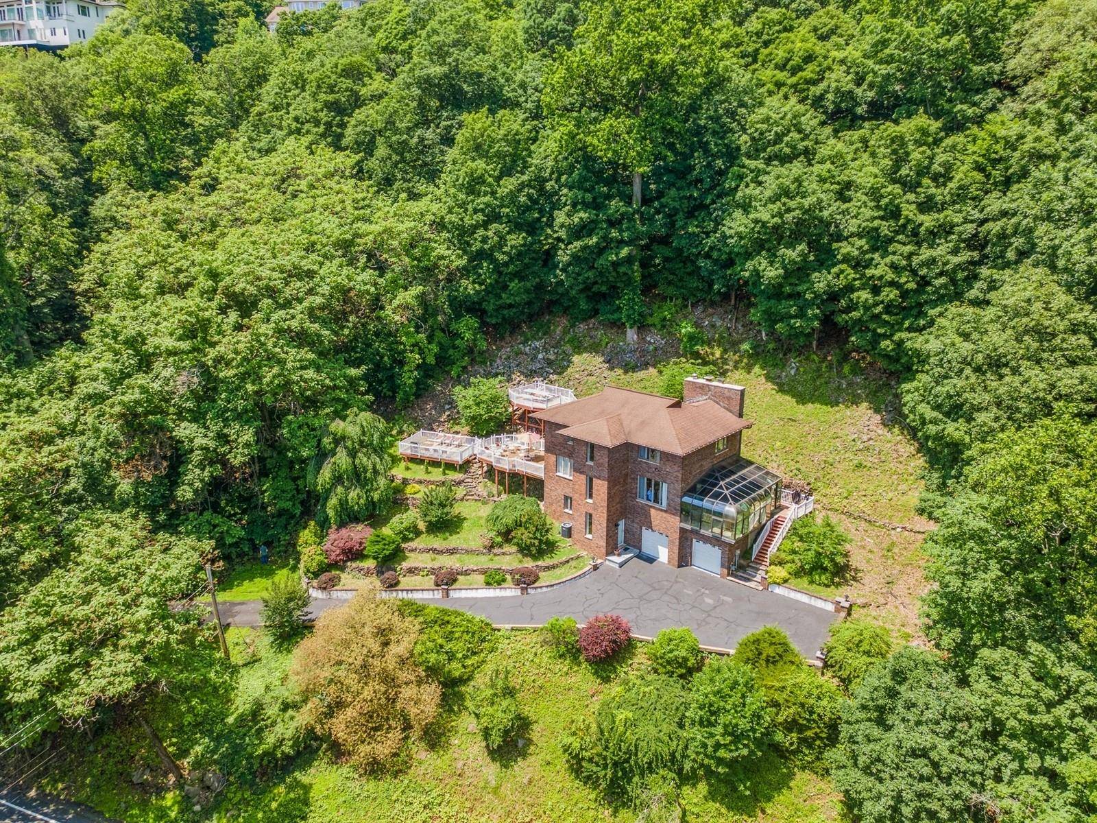 One of a kind river view retreat in prestigious Upper Grandview !