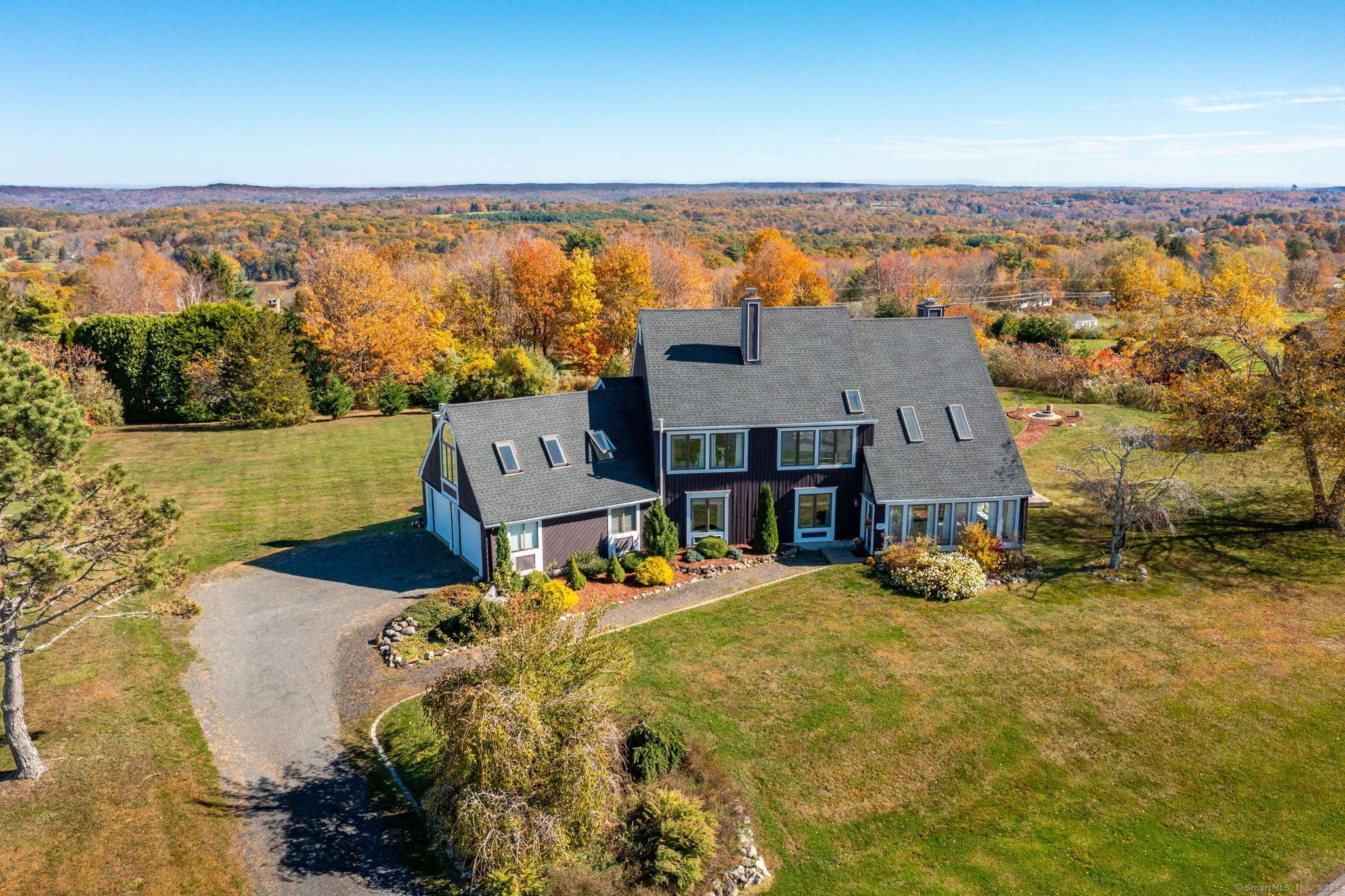 This Contemporary home sits in one of Watertown's most desirable neighborhoods and offers stunning views of the rolling Litchfield Hills.