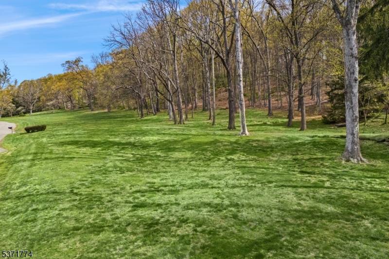 An extraordinary opportunity on ten private, picturesque acres in the heart of prestigious Far Hills.