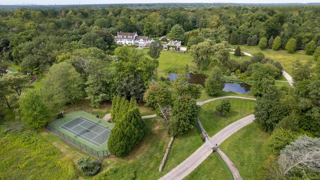 Introducing one of New York's most prestigious estates a rare opportunity to own a historic piece of history elegantly nestled atop 14 park like acres in Purchase.