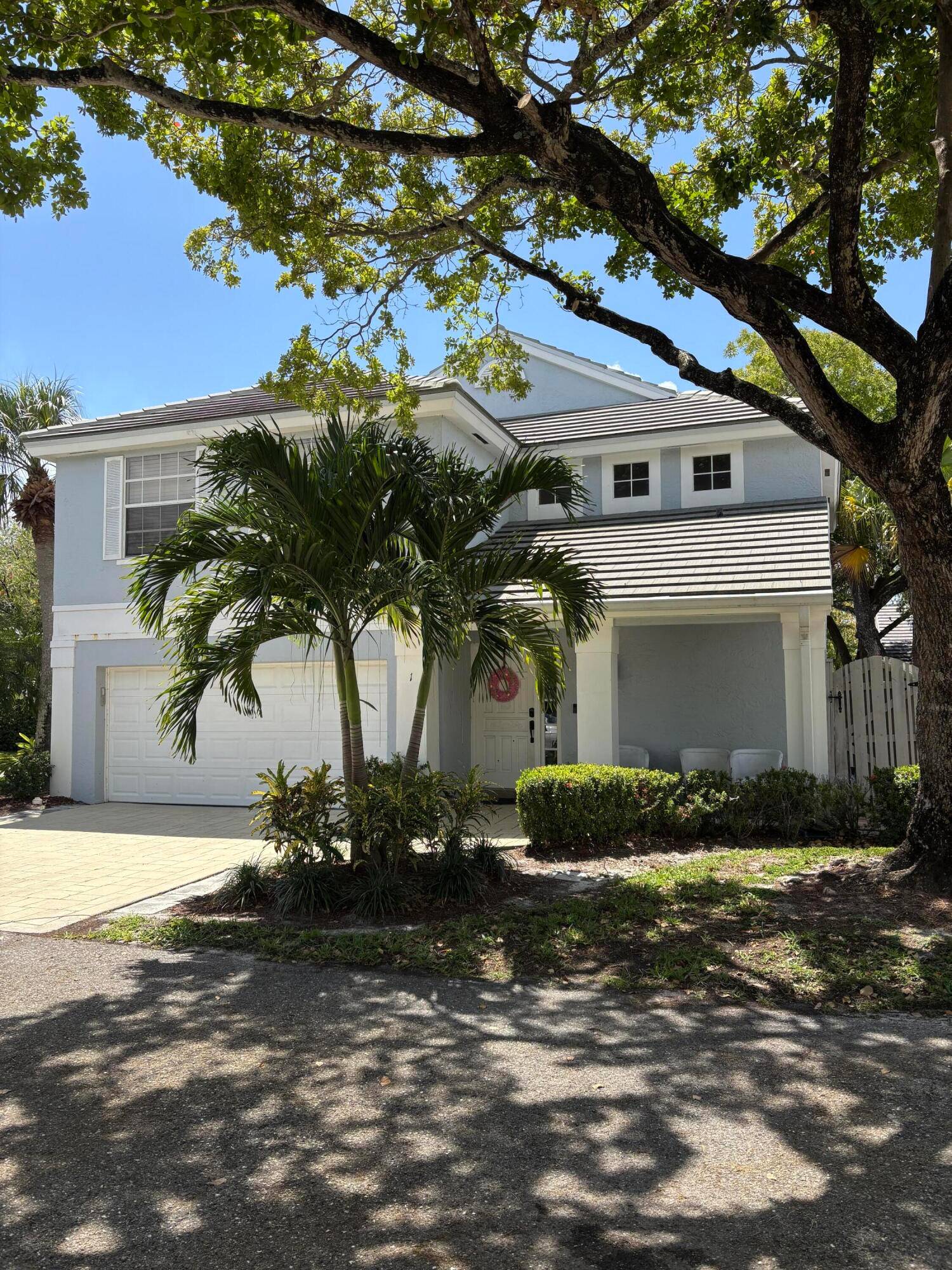 Beautifully designer renovated 3BR 2 1 2 Bath home on a corner lot in the Bristol Club community of PGA National.