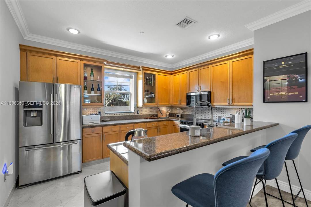 Situated in the heart of Lake Ridge just steps from Victoria Park, this fully renovated townhome blends timeless design with cutting edge smart home living.