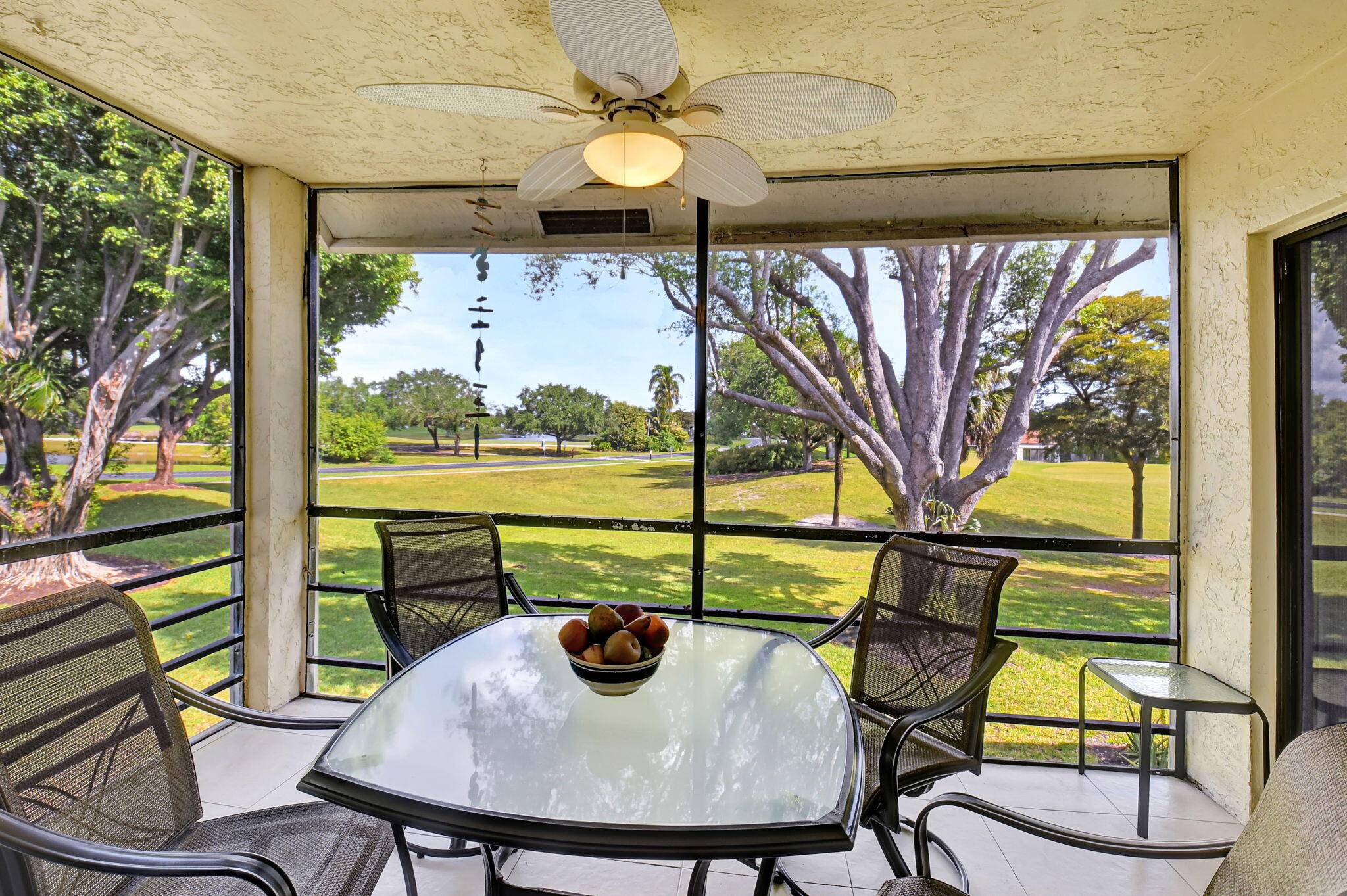 VIEWS FOR DAYS ! ! This 2nd Floor End Unit Condo Has The BEST Panoramic Golf, Garden Lake Views From The Sizeable Screened In Balcony !