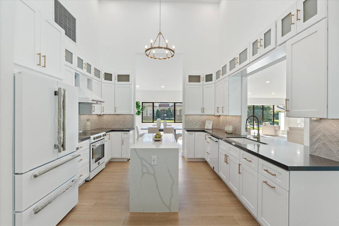 Located in the exclusive Pine Tree Golf Club community, this remodeled residence blends modern design with timeless character.