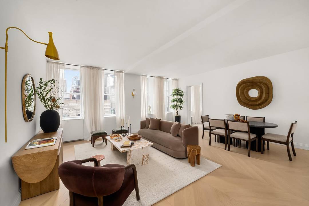 This outstanding two bedroom, two and a half bathroom residence offers exceptional natural light from expansive east facing windows across a luxuriously broad living space, ideally suited for entertaining.