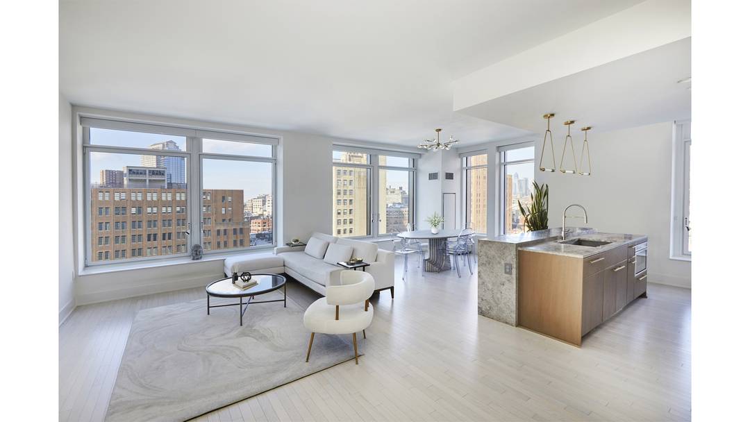Welcome to this wonderfully bright and gracious high floor corner 3 bedroom, 3 bathroom residence with triple exposures at the white glove 91 Leonard Street condominium.