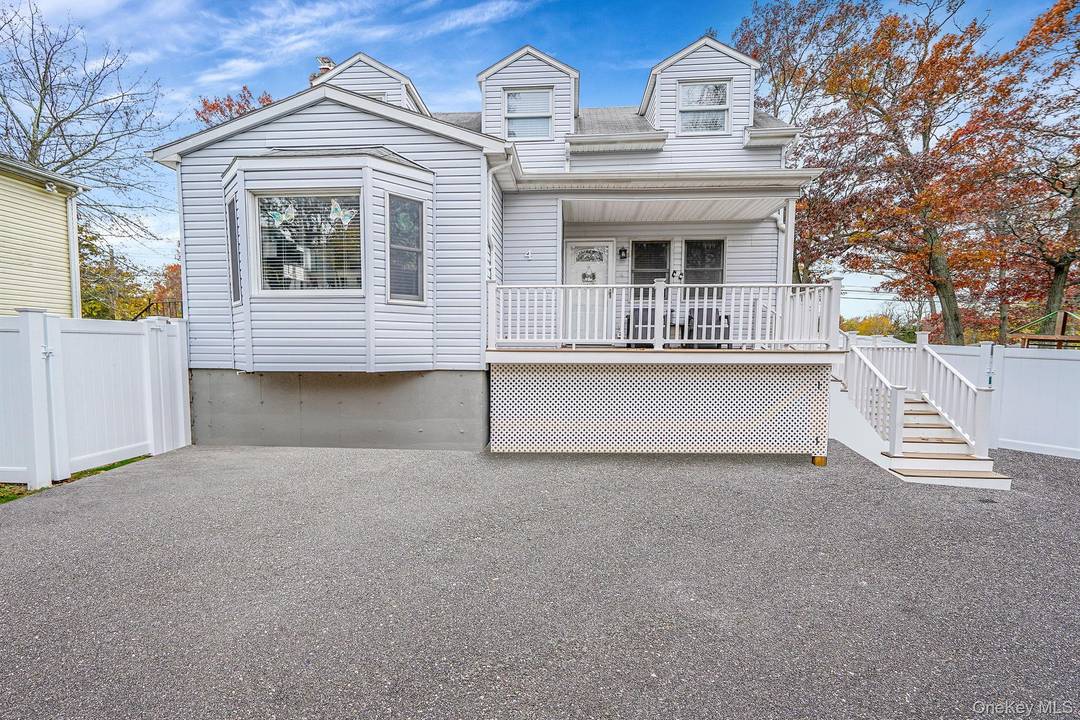 Welcome to 4 Willow Rd in Rocky Point a charming and beautifully updated home set on a spacious corner lot with brand new PVC fencing that enhances both privacy and ...