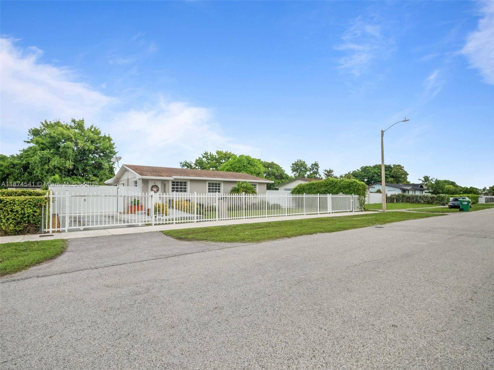 Lovely gated home with all accommodations to just move in, 2022 roof with spacious brand new large concrete terrace ready to enjoy.