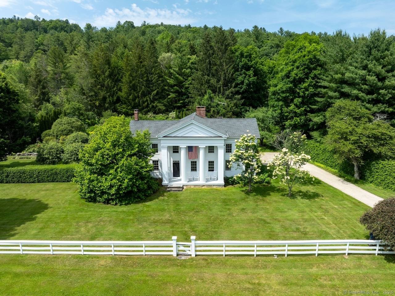A rare and storied offering, the Colonel Dwight Wellington Pierce Farmstead is a distinguished circa 1830 Greek Revival residence listed on the State Registry of Historic Places.