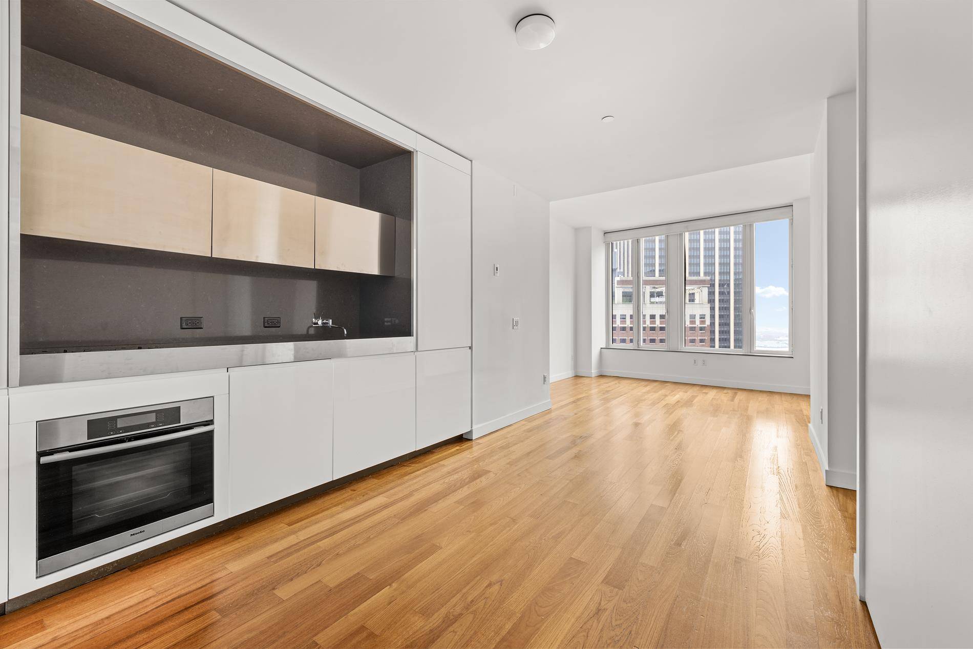 CUSTOM MADE WALKIN CLOSETSTORAGE UNIT INCLUDED IN SALE PRICEDiscover the epitome of urban living in this oversized one bedroom, perfectly situated on the 21st floor of the iconic 15 William ...
