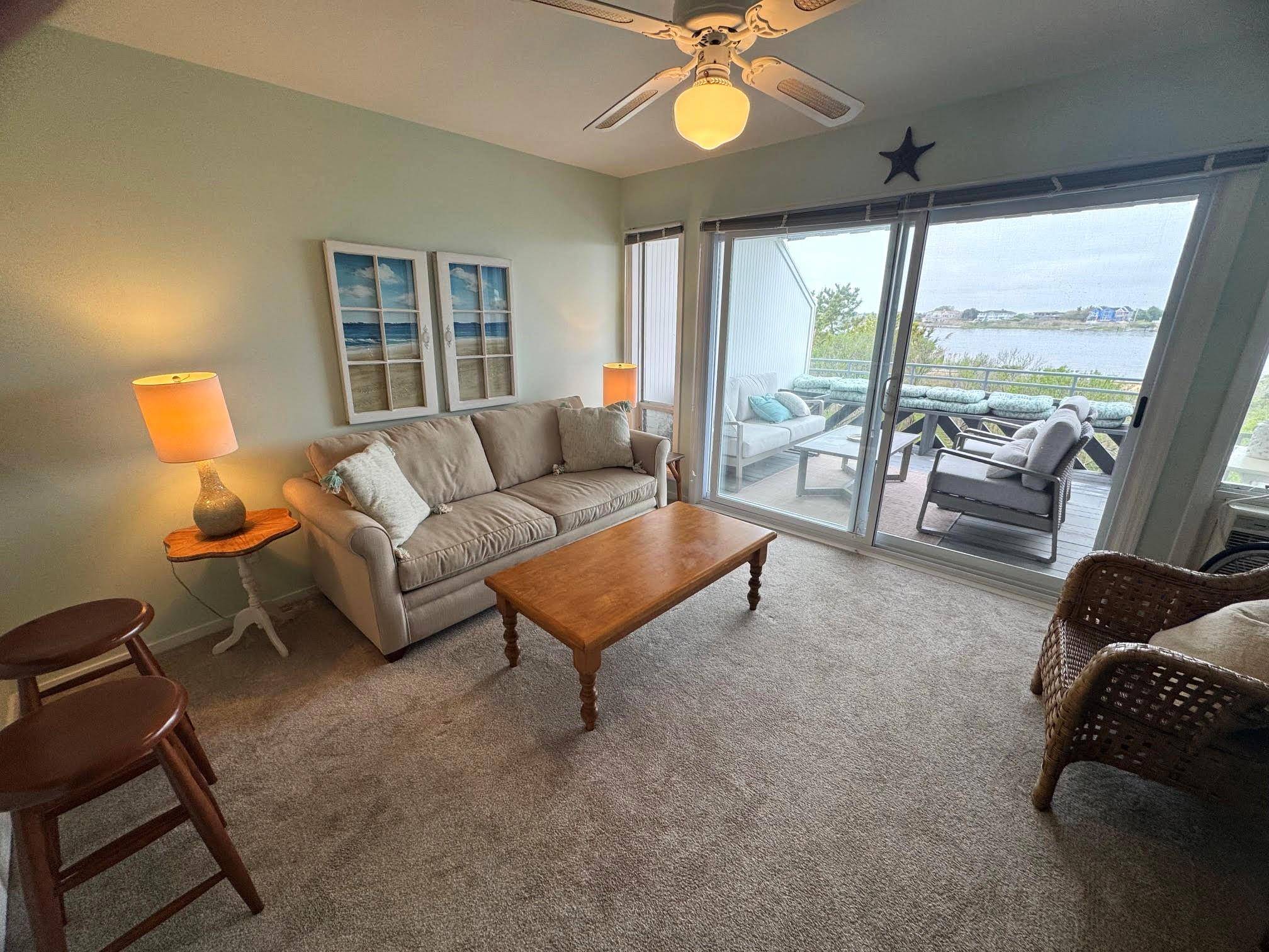 Spend your summer season in this first level one bedroom one bath condo overlooking Moriches Bay in the Bay Mor Club Community.