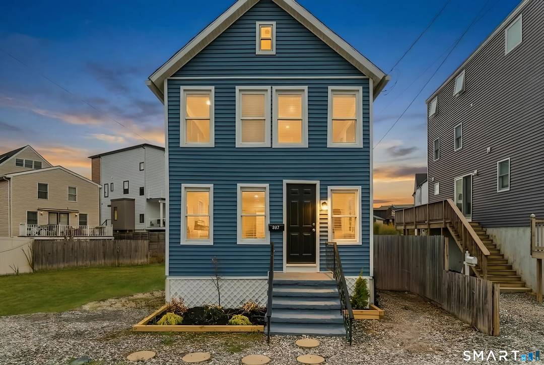 Wake up to coastal breezes and water views in this charming beachside Colonial, perfectly positioned just 87 steps to the sand.