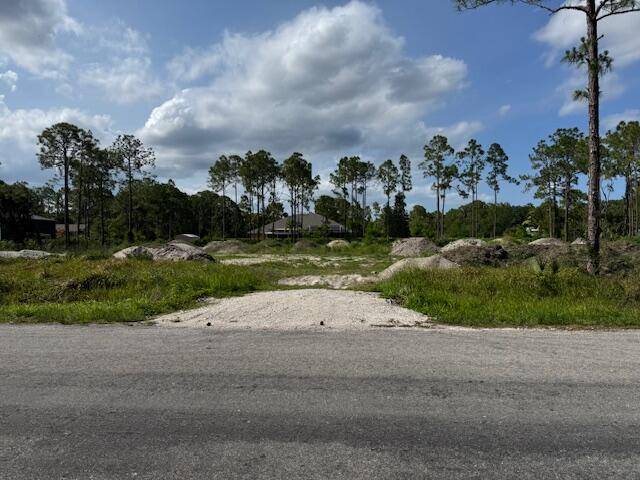 Lot ready to build on paved road in the acreage !