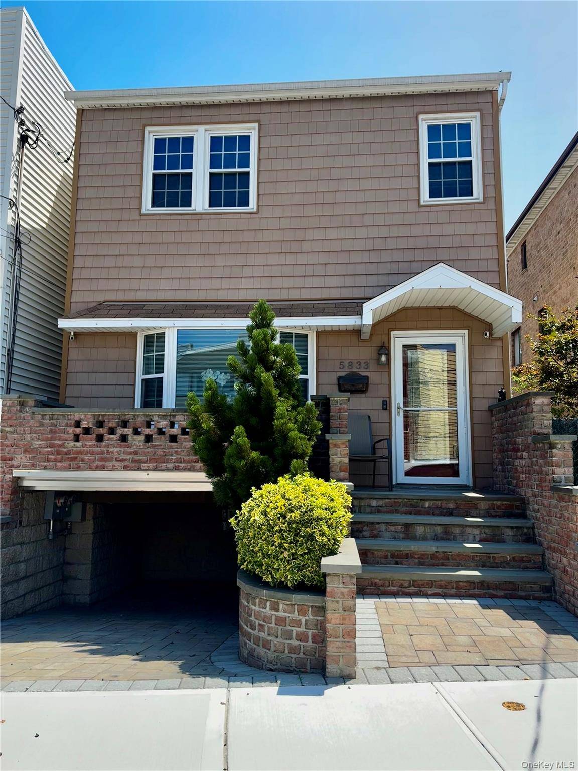 Welcome to 58 33 71st Street, a stunning legal two family detached home, currently configured and used as a spacious single family residence.