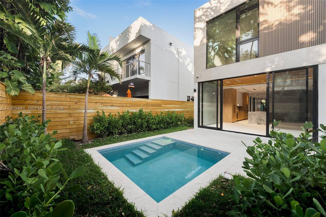 A striking new construction in Coconut Grove, blending contemporary design with timeless comfort.