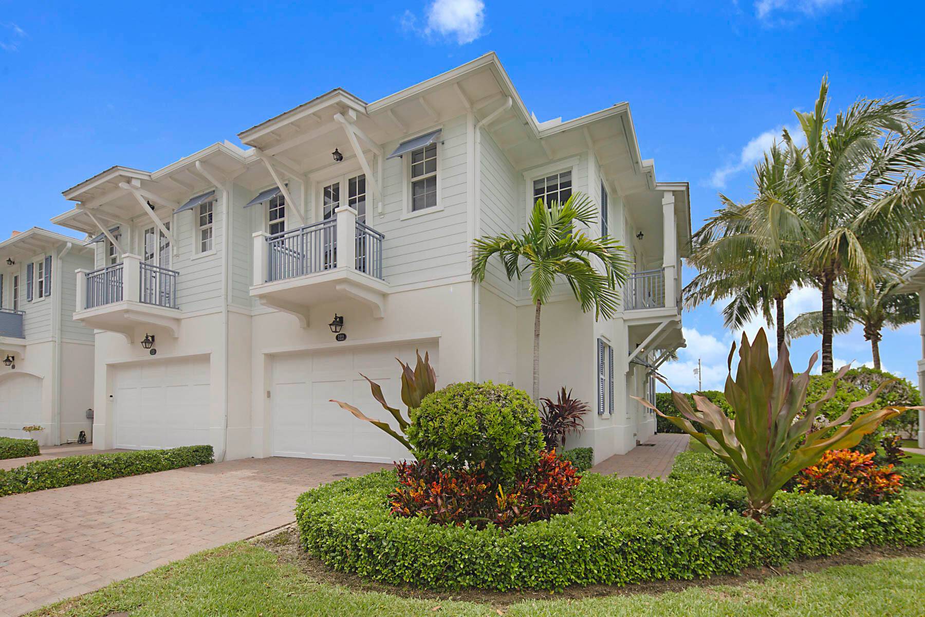 Experience coastal luxury in the heart of Juno Beach with this beautifully designed Key West style end unit townhome.
