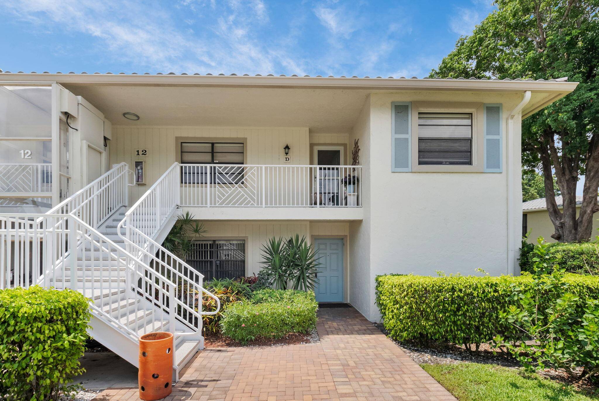Enjoy serene water views from this light and bright first floor condo, perfectly designed for comfortable living and effortless style.