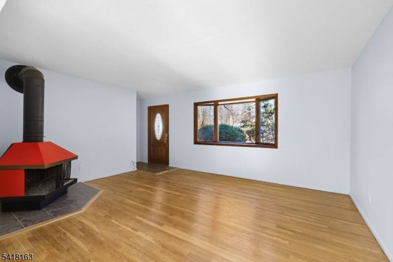 Discover the perfect blend of charm, convenience, and natural serenity at this move in ready single family home in the highly desirable Cupsaw Lake membership Optional area of Ringwood, NJ.