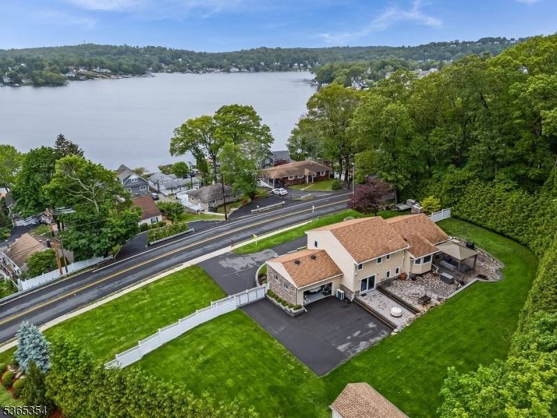 Nestled in a prime location w breathtaking year round lake, water views, and proximity to train station commuting, this custom designed split level offers exceptional living across 3 thoughtfully crafted ...
